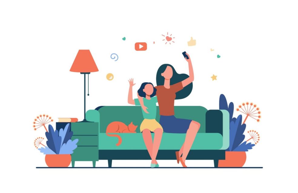 Mulher e criança usam as redes sociais no telemóvel